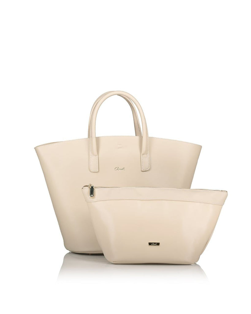 cream bucket shaped back with gold Axel logo and top handles and matching cream pouch with top zip and gold Axel loogo