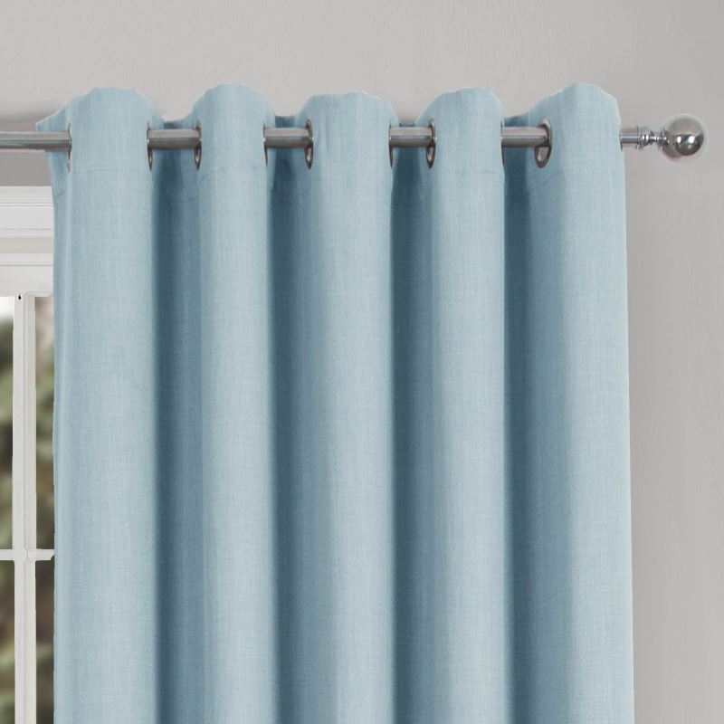 light blue ring-top curtains on a sliver curtain pole
