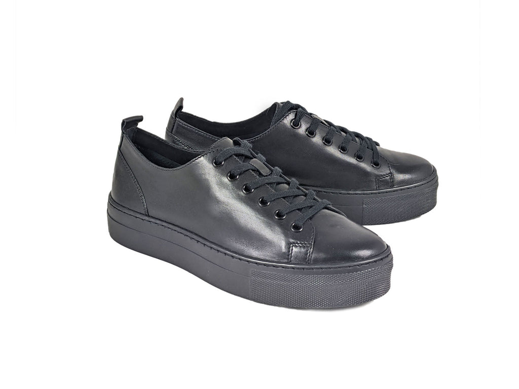 pair of black leather laced trainers with a thick black platform sole