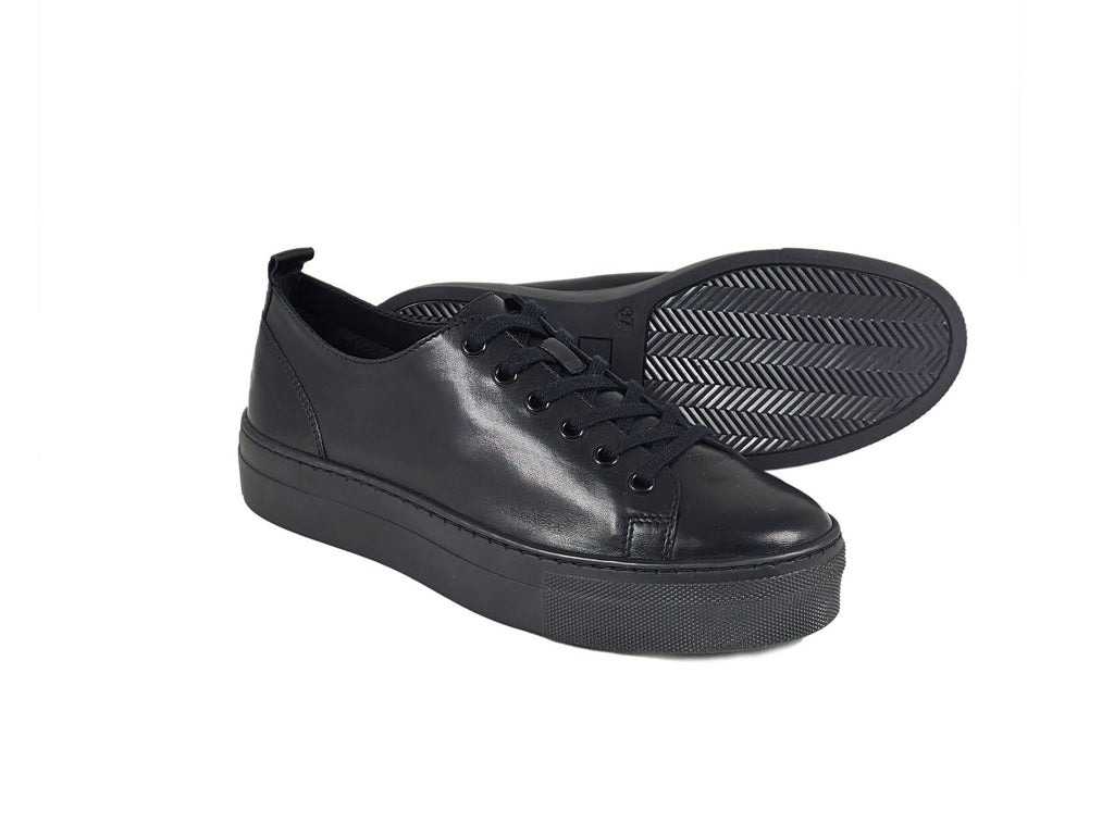 pair of black leather laced trainers with a thick black platform sole, back shoe on side showing black sole