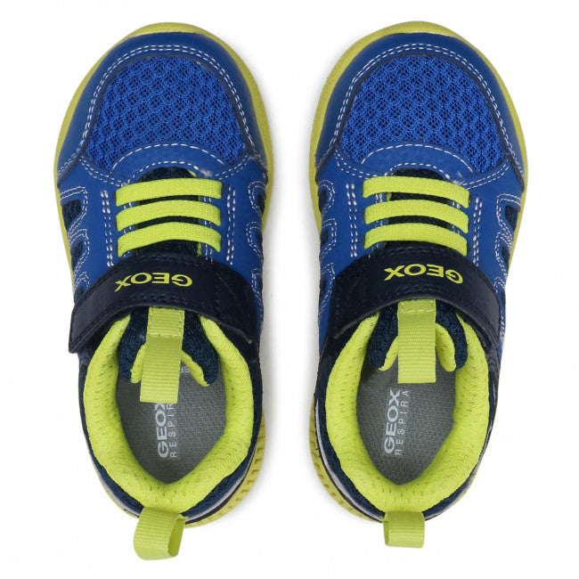 Boy's Geox runners with panels of light blue and navy blue, with bright yellow details and bungee lace. Features velcro ankle strap.