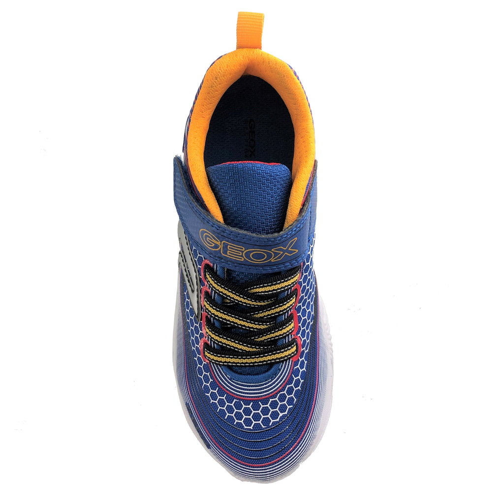 Royal blue runners with yellow laces, a velcro strap with the Geox logo, Geox symbol on the side, white geometric designs across the shoe on a thick white sole