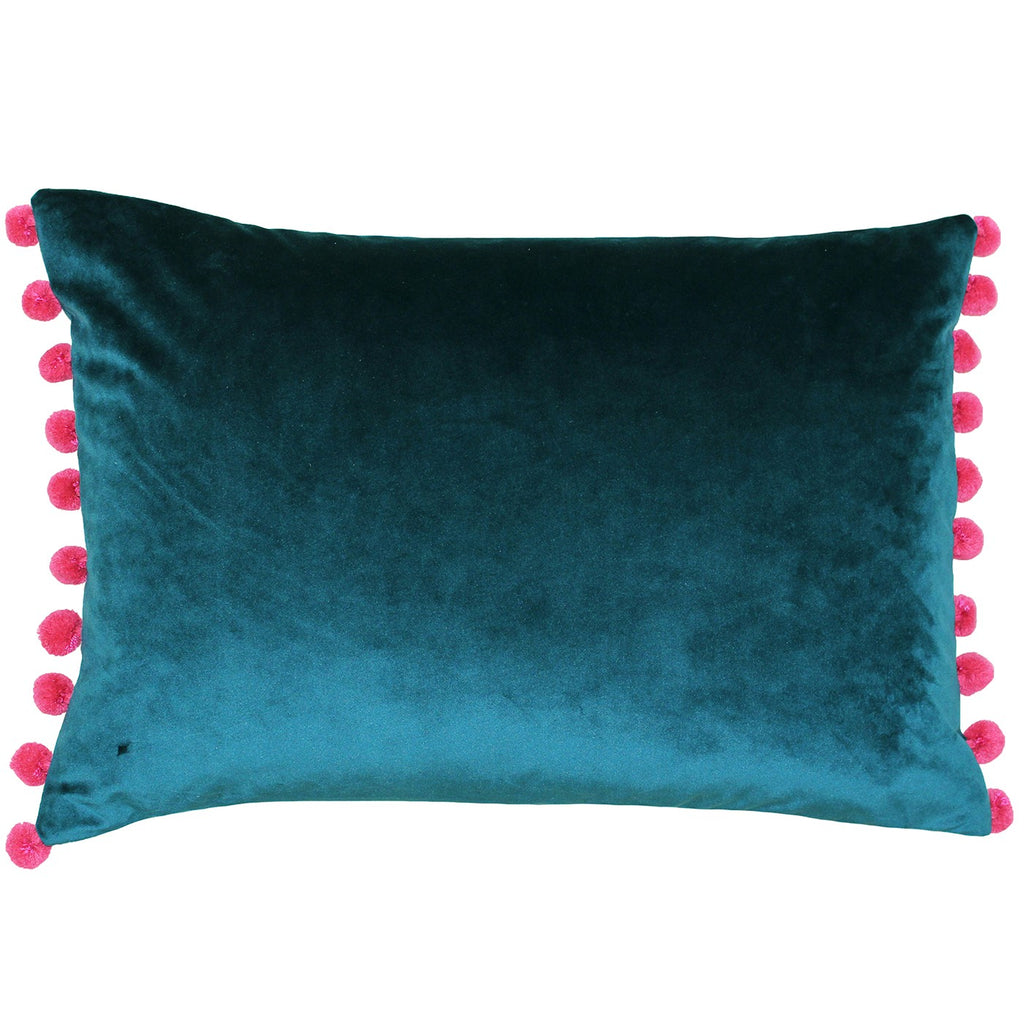 rectangular teal blue cushion with pink pom poms on the short sides of the cushion